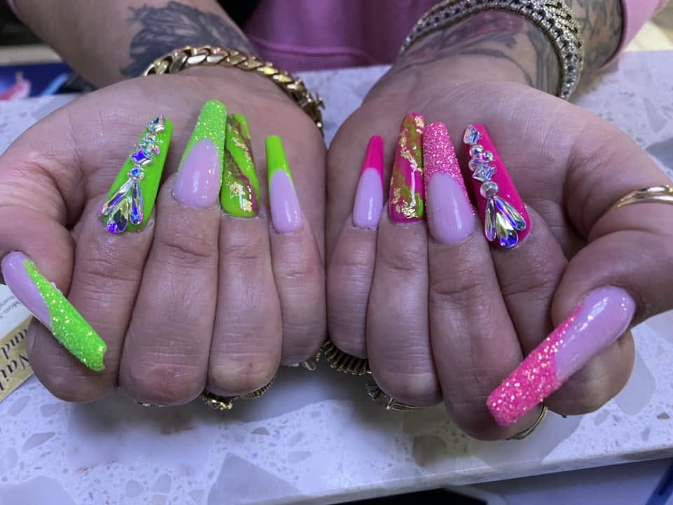 Bold pink and green acrylic nail sets with crystals at Pleasant Nails & Spa